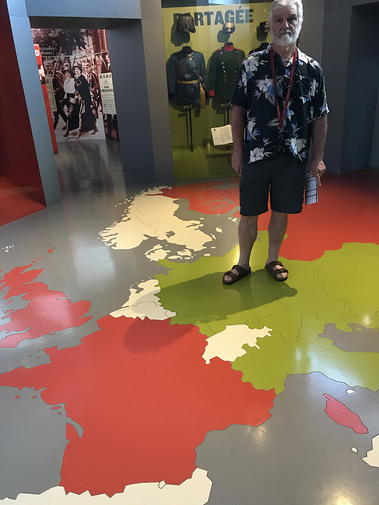 Steve standing on Germany - a map on the floor in the  Museé de la Grande Guerre de Meaux 